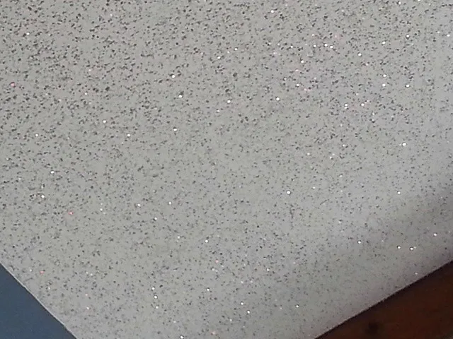Sprayed ceiling with fine glittering flecks through the coat